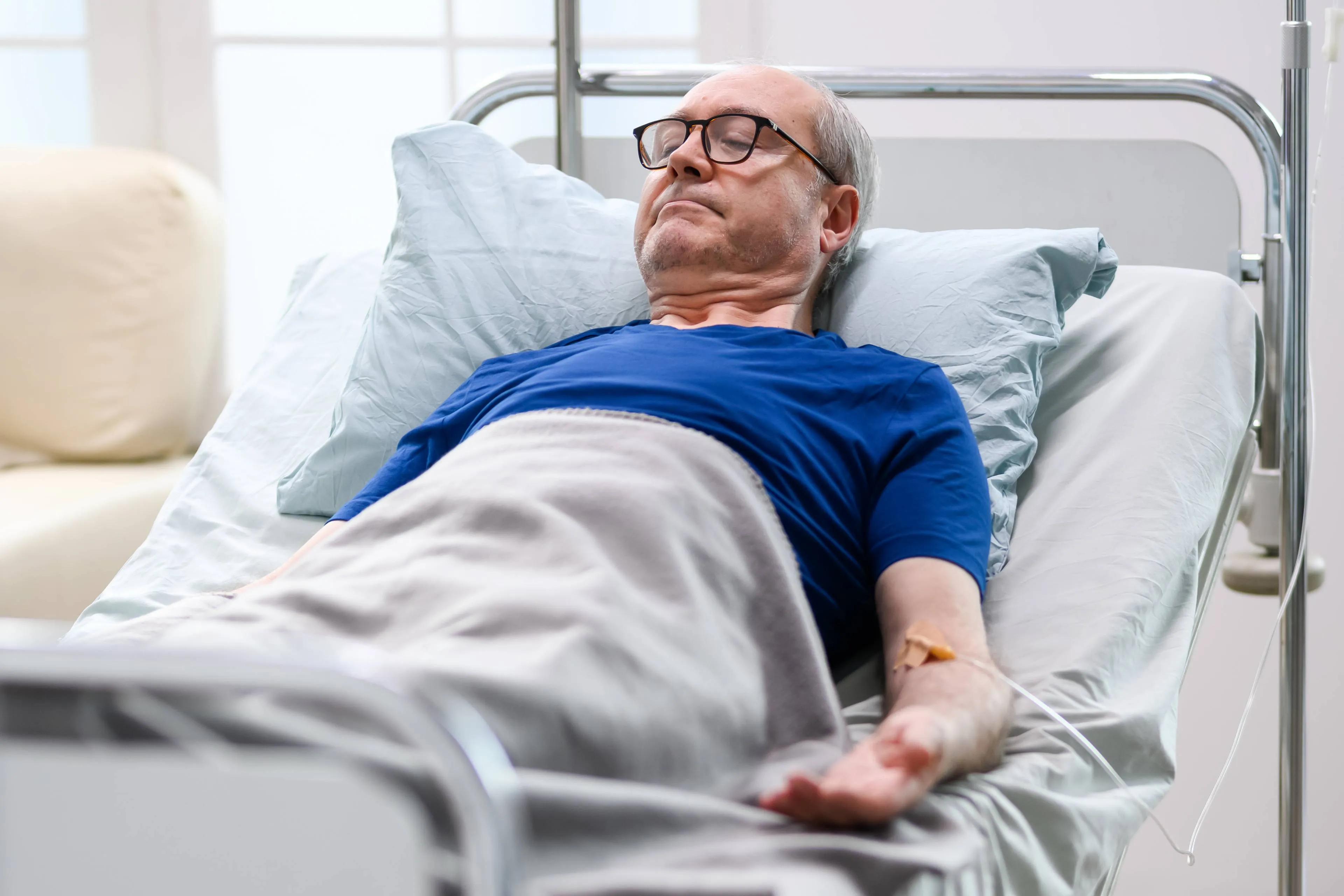 peaceful-retired-old-man-nursing-home-laying-bed
