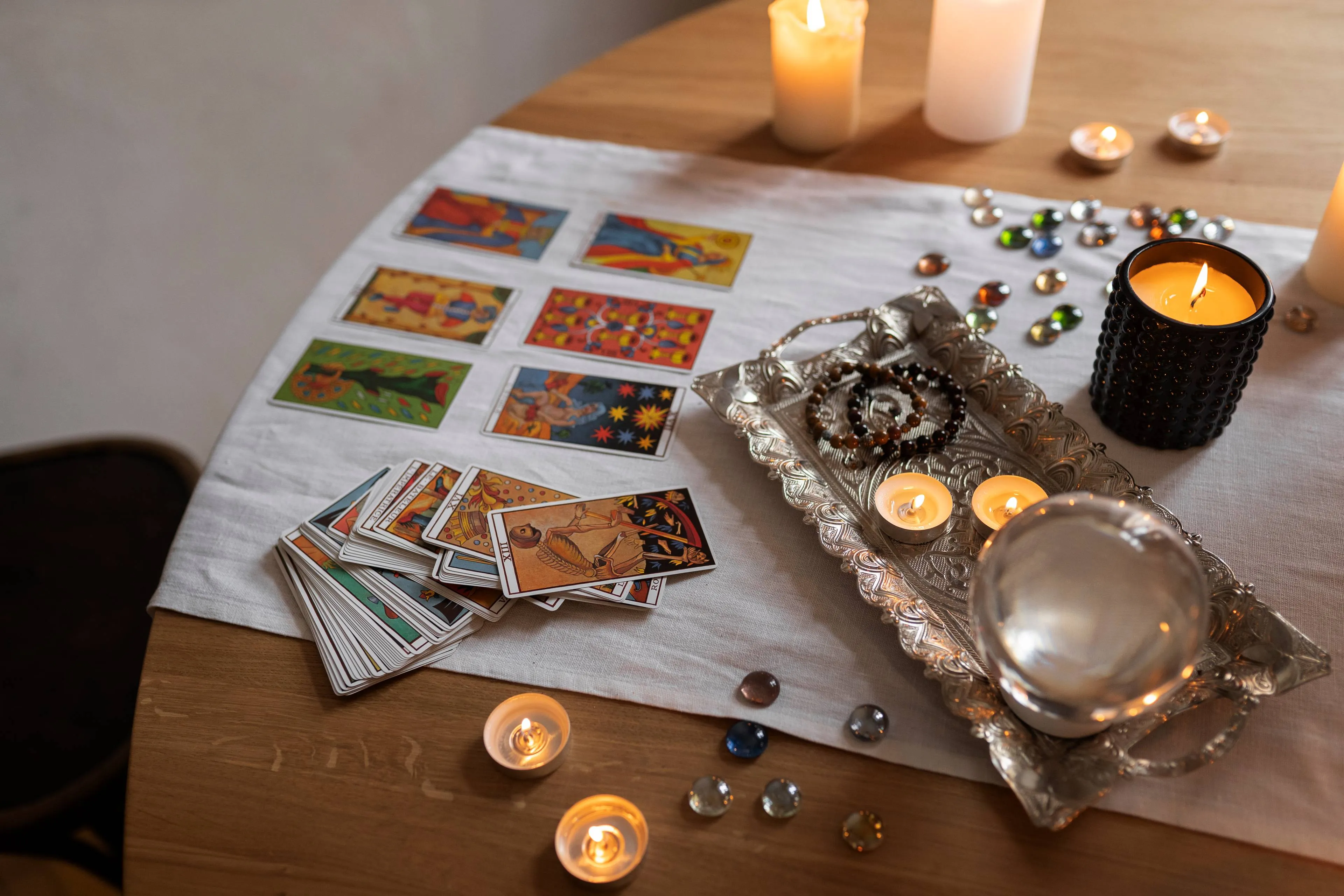 high-angle-tarot-cards-arrangement-table