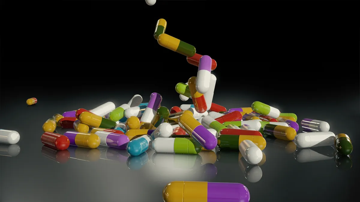 3d rendering veelkleurige medische pillen vallen van boven naar beneden
