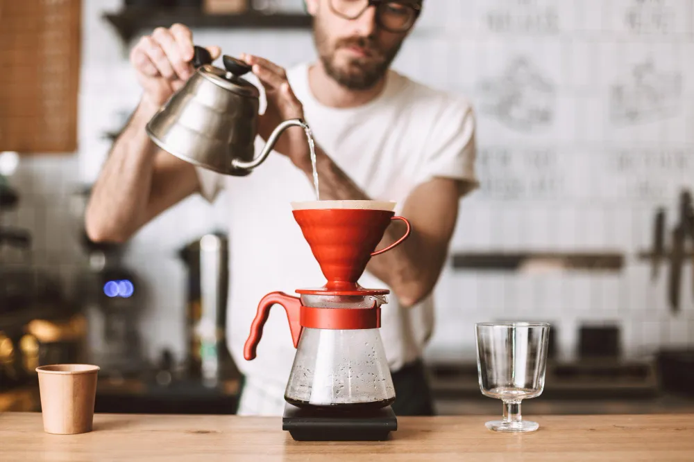 close up photo barista standing counter preparing pour coffee cafe 1