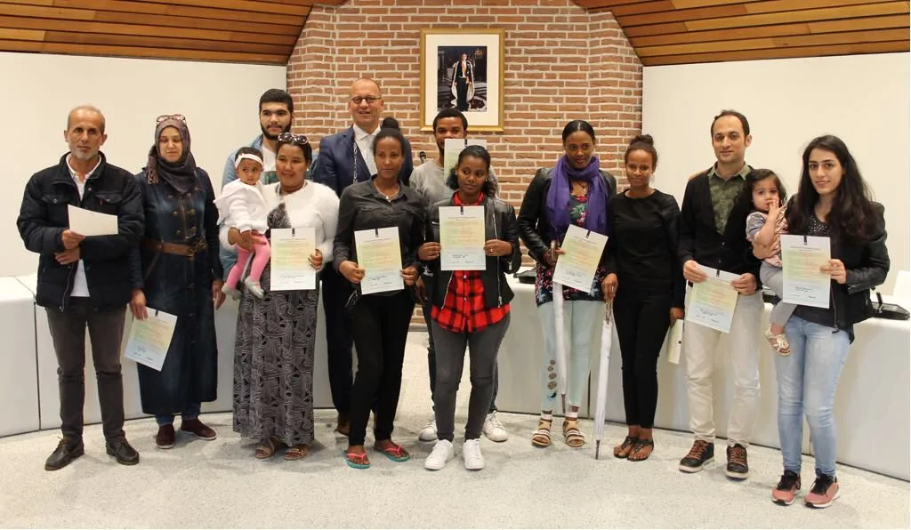 statushouders tekenen participatieverklaring