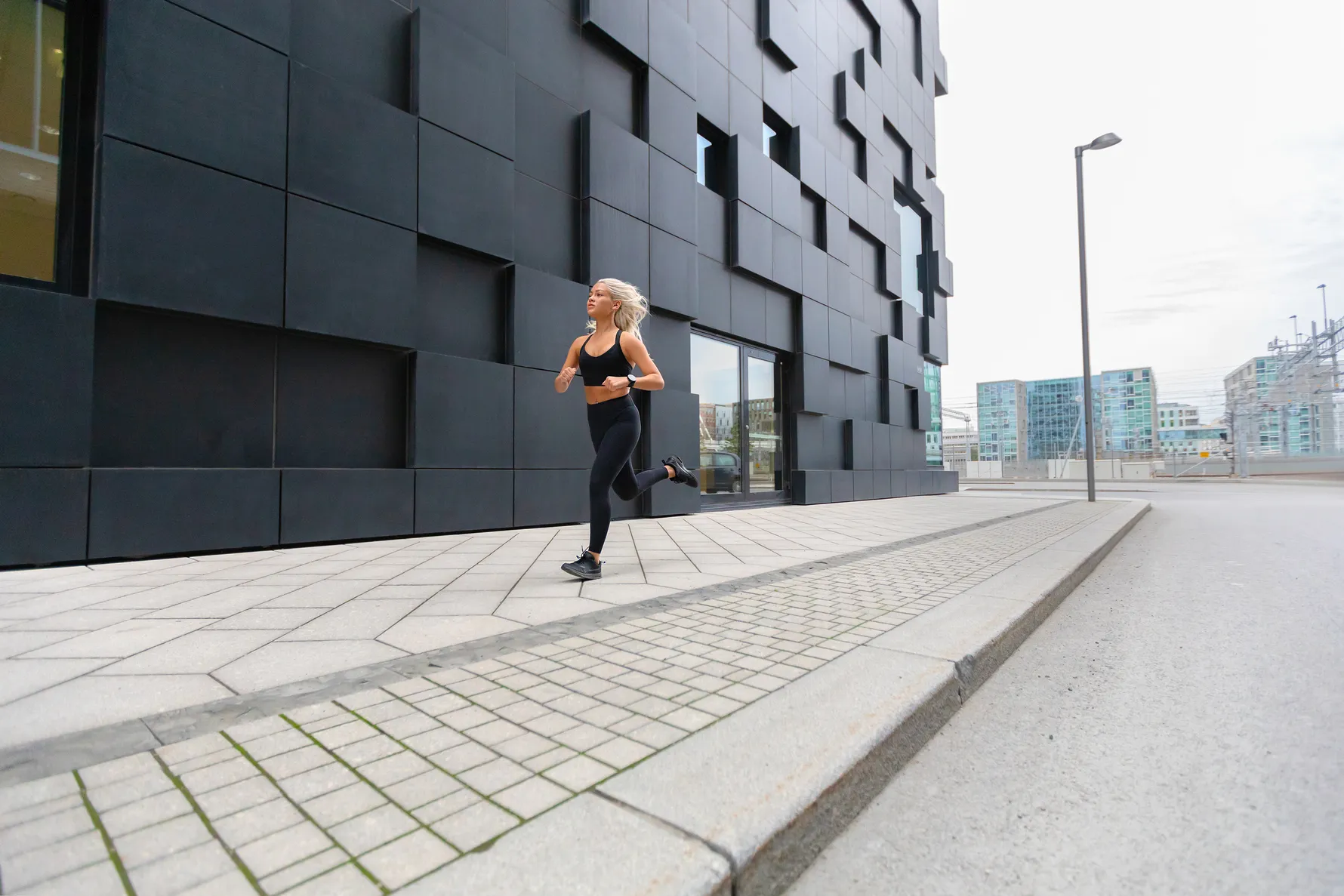 focused fast running woman wearing sports top in m hmstg9v 50