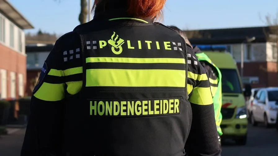 politie hondengeleider stock
