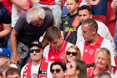 amsterdam 11 05 2025 johancruyff arena dutch eredivisie football season 2024 2025 match between ajax and nec ajax supporters watch the feyenoord psv game on his phone