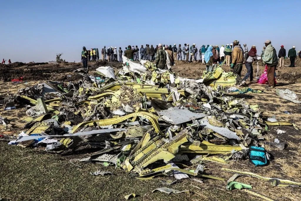 people stand near collected debris at the crash site of news photo 1129799170 1552316414
