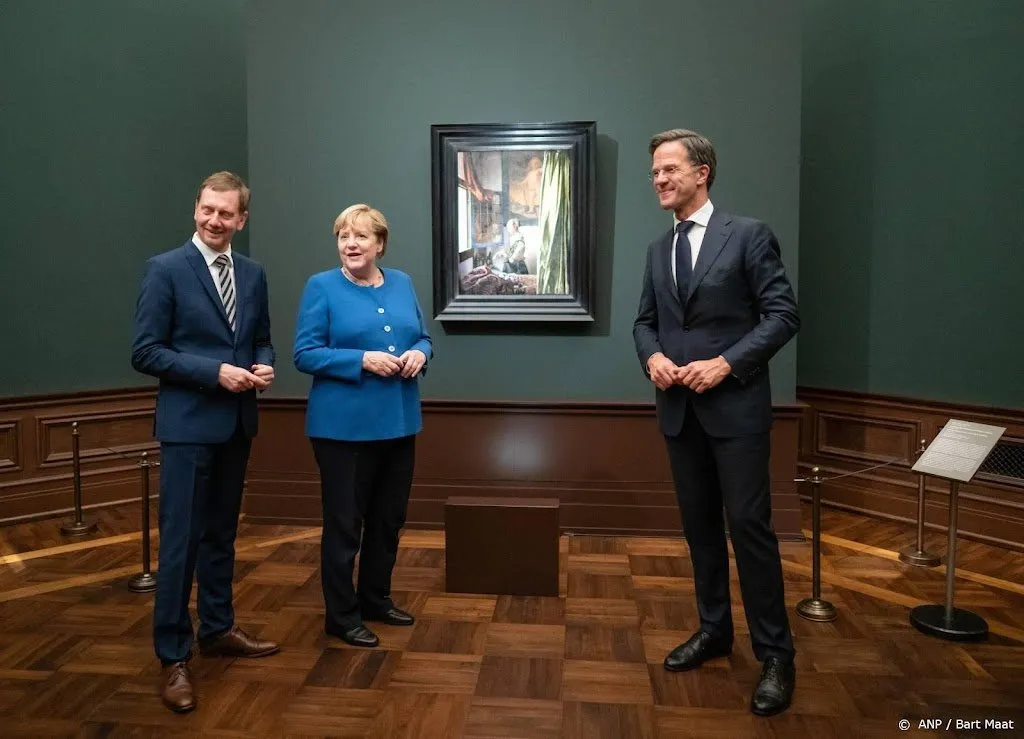 rutte prijst merkel uitbundig onder het oog van vermeer1631209003