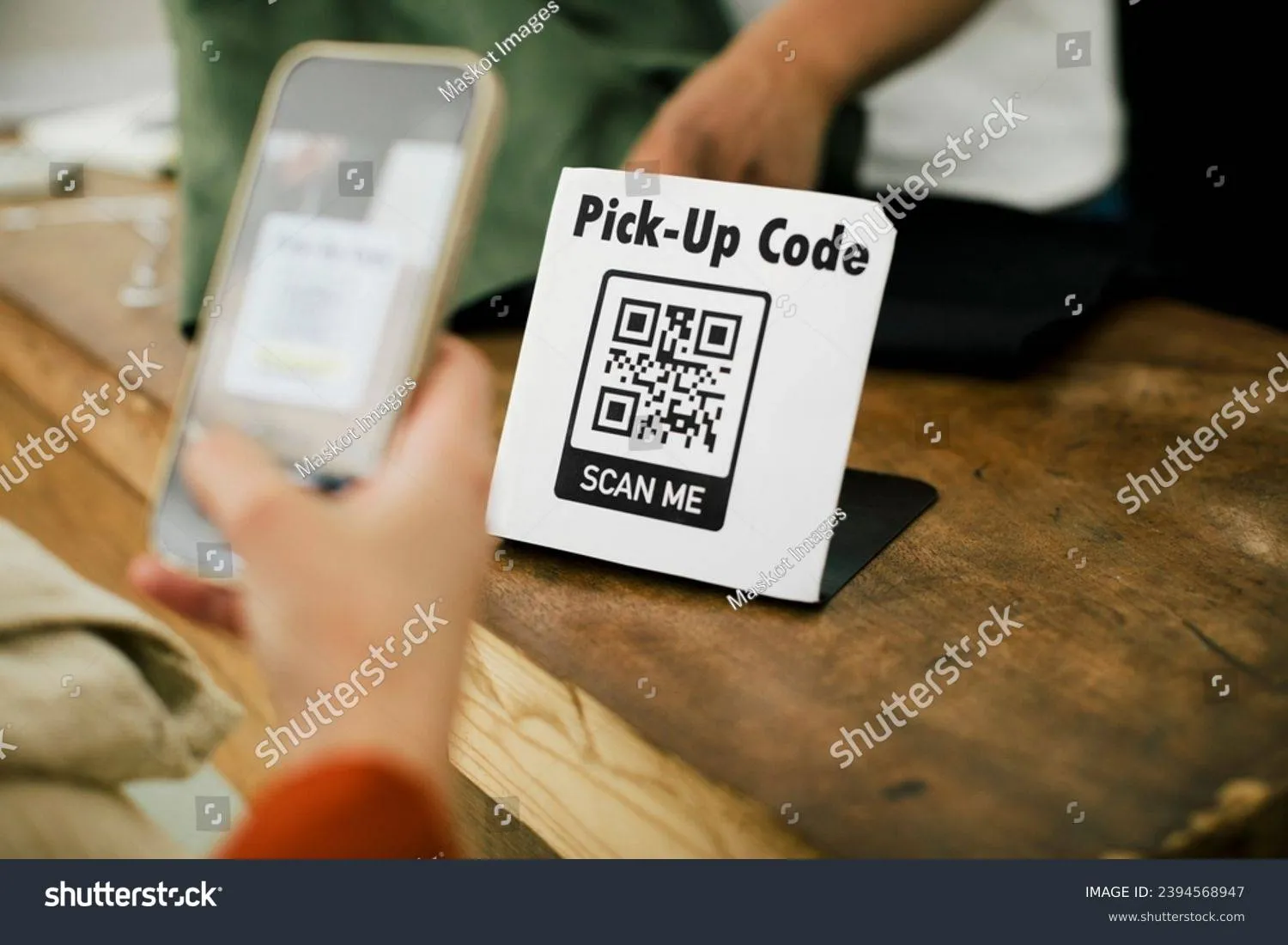 stock-photo-hand-woman-scanning-qr-code-through-smart-phone-while-doing-online-payment-at-store-2394568947 (1)