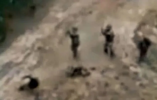 troops-tell-body-pits-unarmed-1061781627