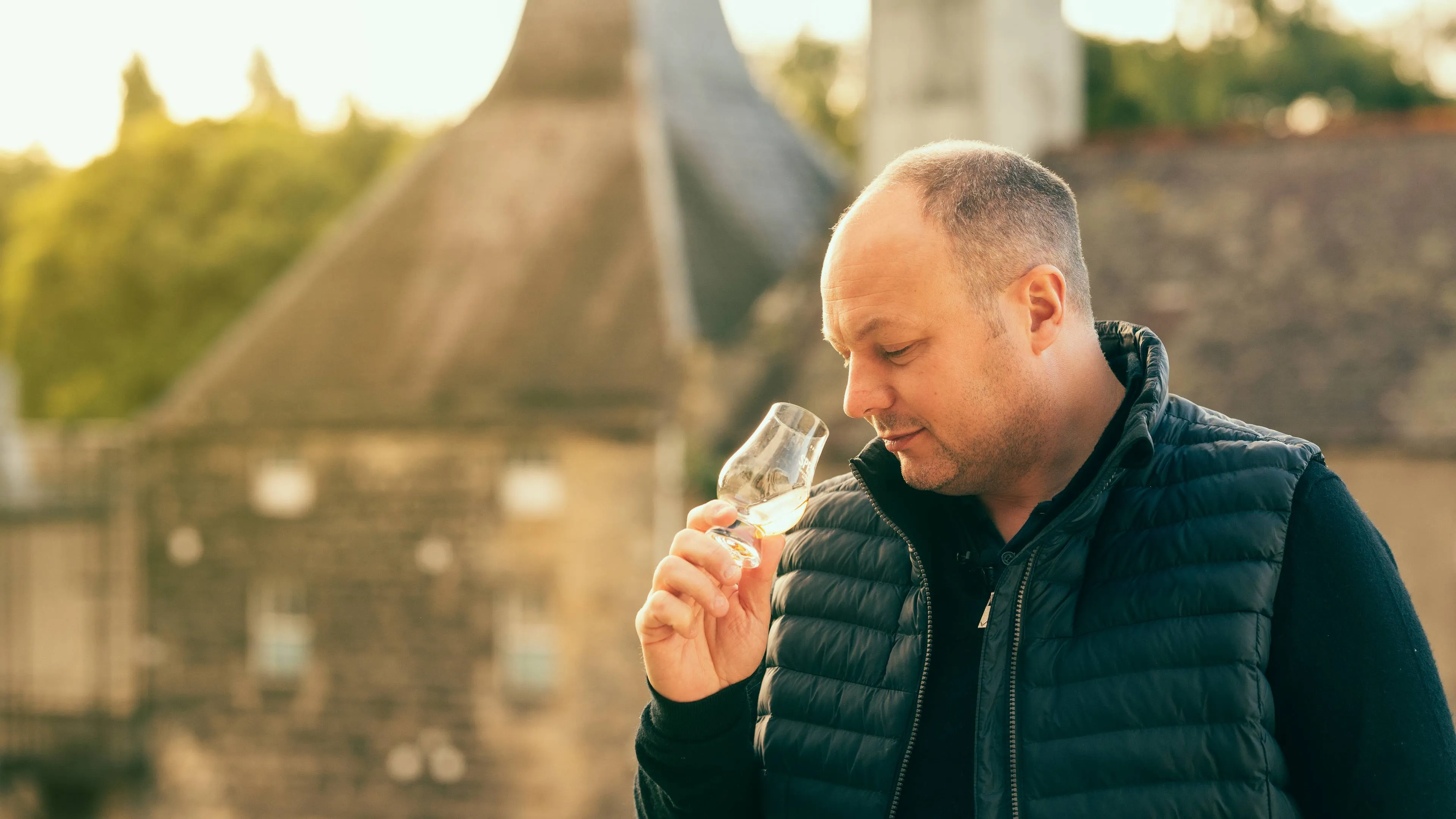 speyburn distillery euan henderson distillery manager nosing dram outside landscapejpg