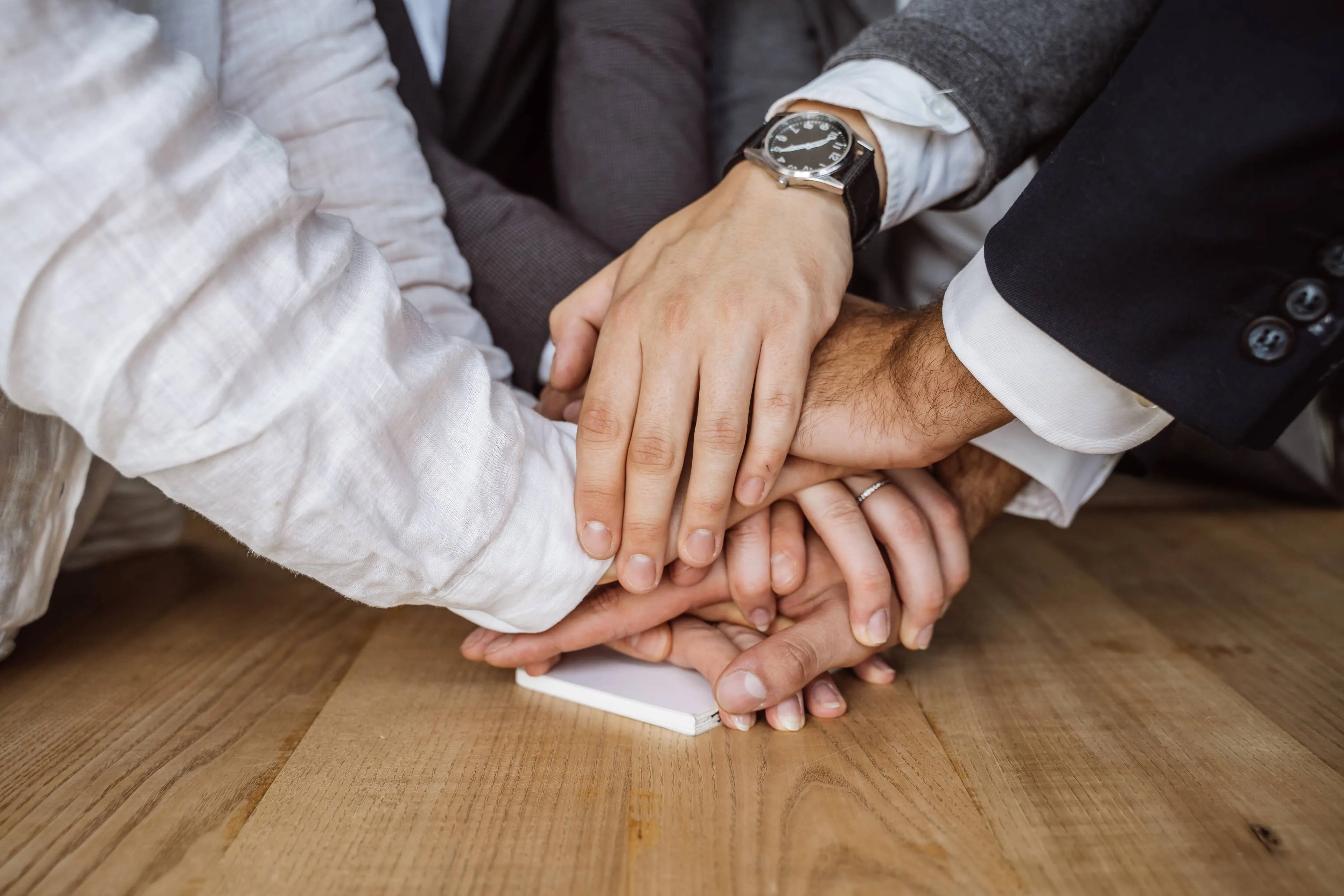 united-hands-business-team-workspace-background