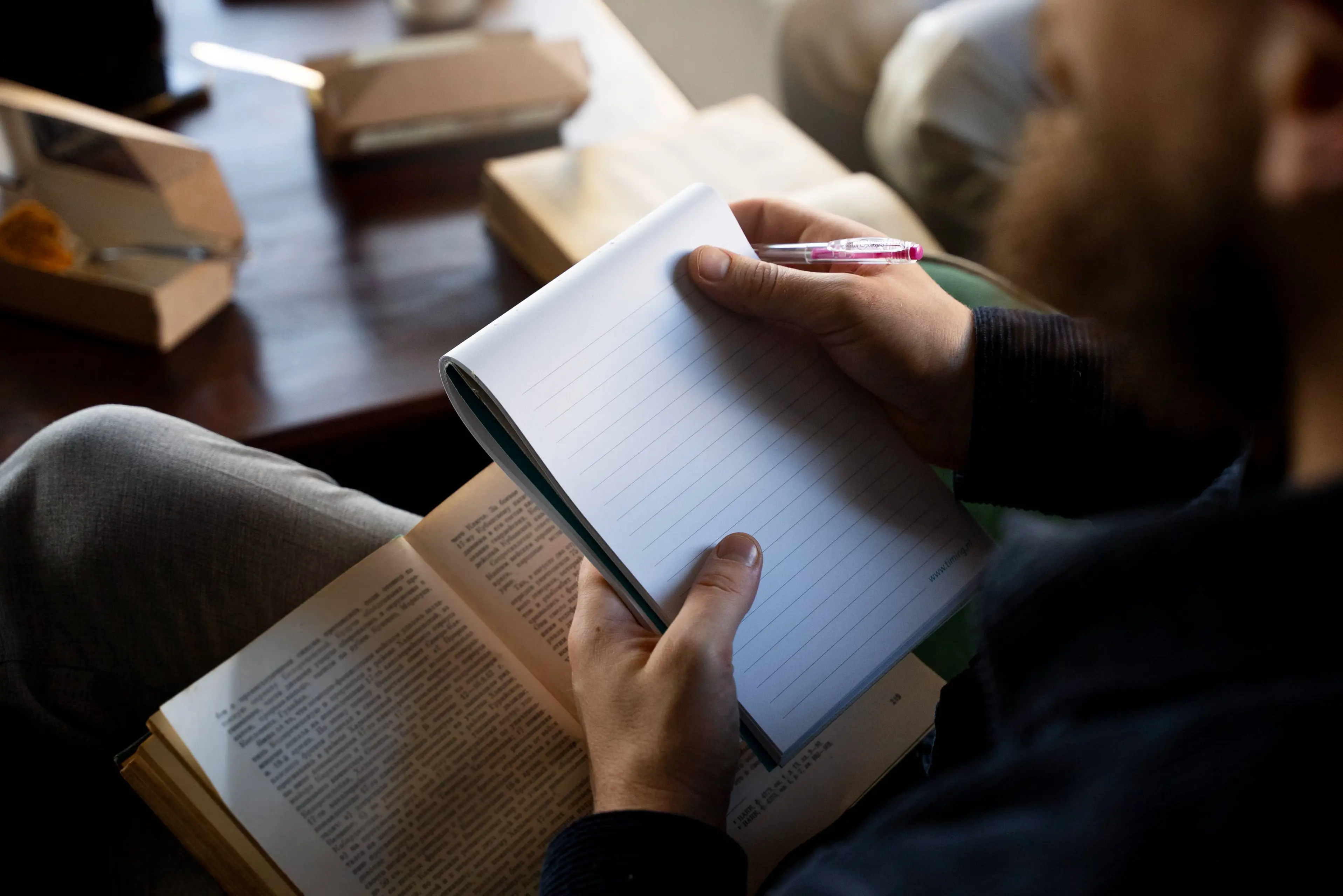 high-angle-man-holding-notebook