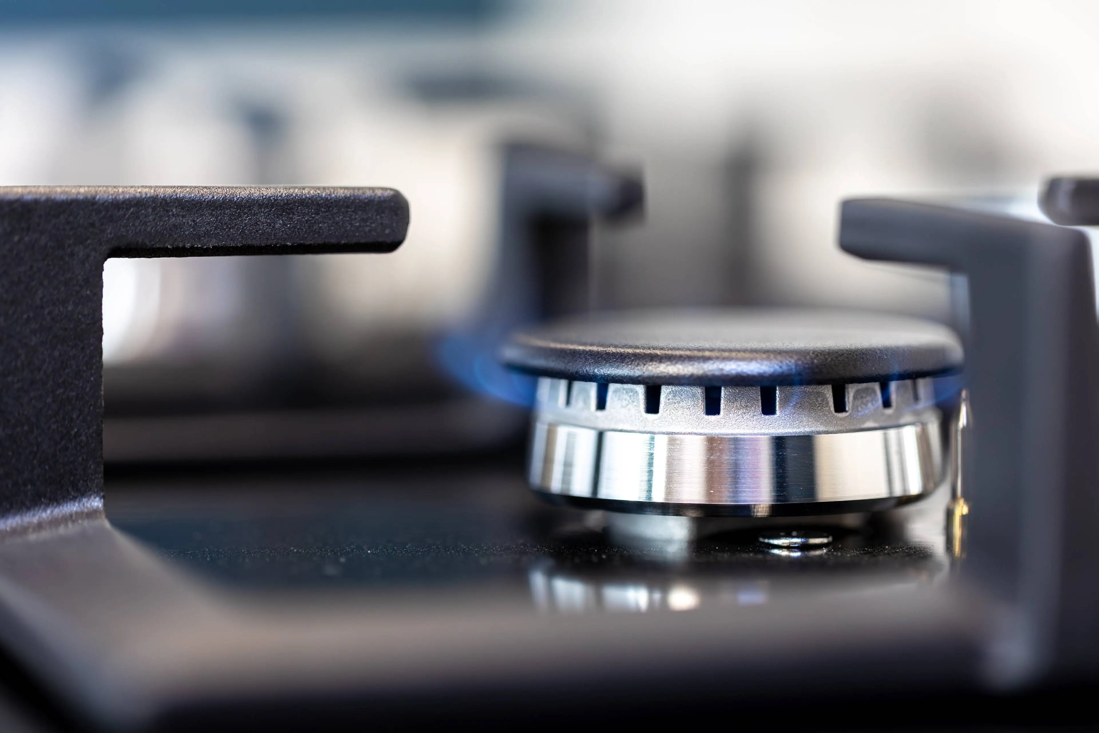 gas-burner-macro-flame-detail-modern-kitchen-surface