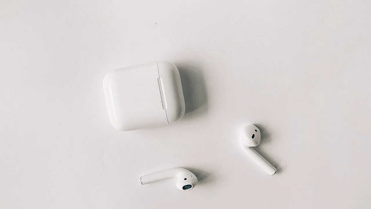white apple airpods on white table 3825517f1603728072