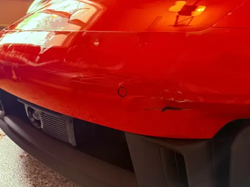 Porsche 911 paraurti rigato