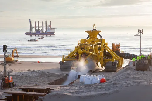 moonfish begraaft de zeekabel op strand heemskerk fotograaf jorrit t hoen