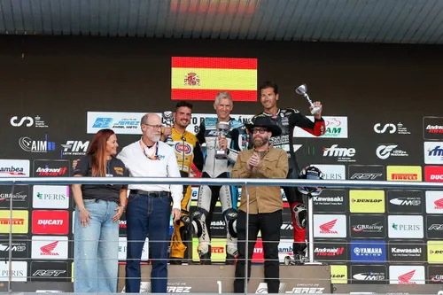 Race 1 podium: David Checa, Andrea Tomio, and Ruben Xaus
