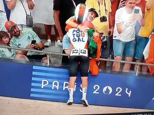 Iuri Leitão clings to his wife after winning Gold at the Madison alongside Rui Oliveira in Paris