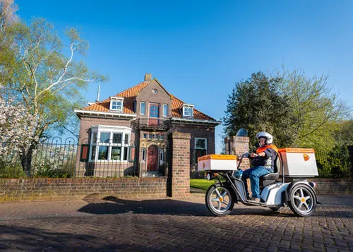 <em>De elektrische driewielscooter van PostNLFotocredits: PostNL<\/em>