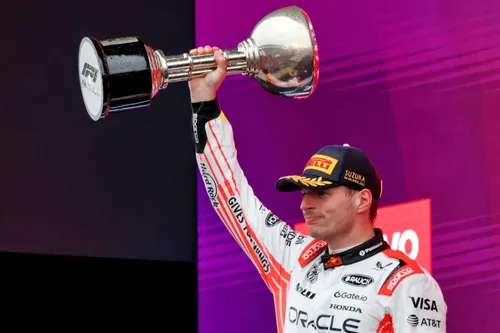 Verstappen lifts the winning trophy after the Japanese Grand Prix