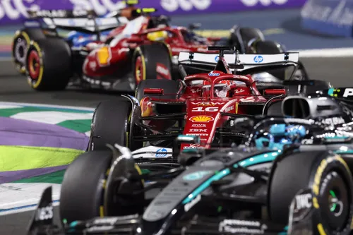 Charles Leclerc fighting for position at the start of the Saudi Arabian Grand Prix with George Russell