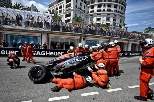 Monaco GP Marshalls attempt to extricate Sergio Perez stricken Red Bull from the race track