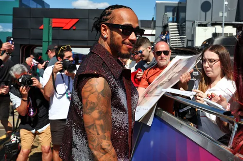 lewis hamilton greets ferrari fans at the british grand prix