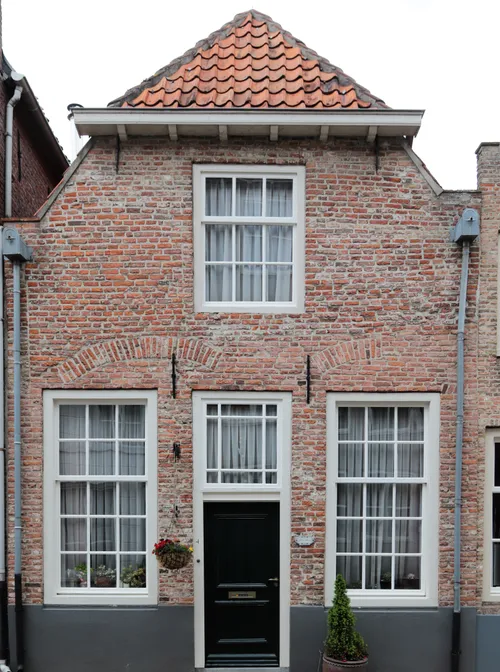 Het huidige en gerestaureerde pand