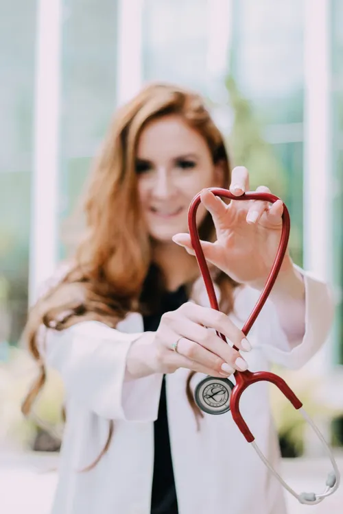 photo of woman holding red stethoscope 3408368 1