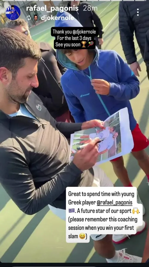 Novak Djokovic signs photo with pen.