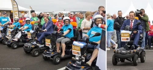 minister op scootmobiel
