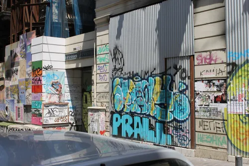 even farther up the street toward the prime shopping area there were buildings that looked as if they had been left alone for a long time