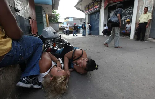 people duck as poice begin more shooting