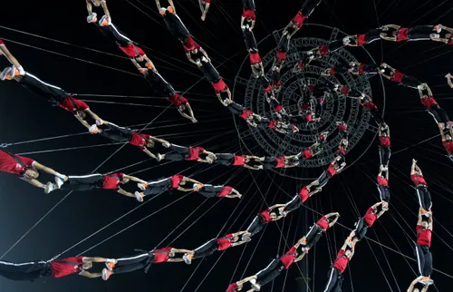 the students of the shaolin tagou martial arts school are suspended in mid air as they practice for stunt performance as part of the opening ceremony for the 2014 nanjing youth olympic games