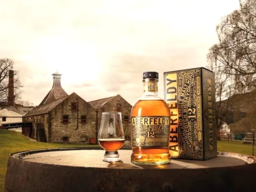 Aberfeldy madeira cask in front of a barn