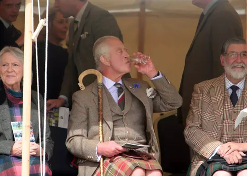 King Charles drinking whisky