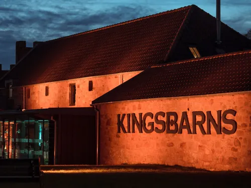 The beautifully illuminated distillery in the evening