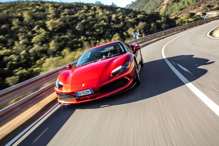 ferrari 296 gtb rossa driving