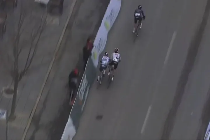 Jan Christen pushes Maxim van Gils into the barriers at the 2026 Clasica Jaen Paraiso Interior