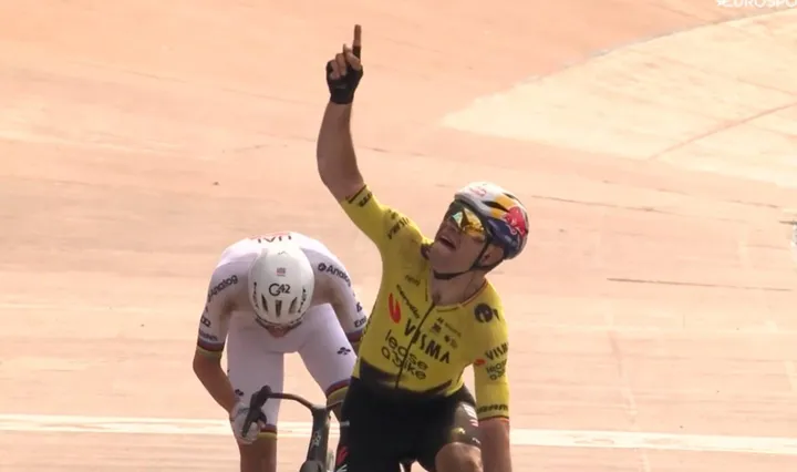 Wout van Aert celebrates his victory at Paris–Roubaix 2026 ahead of Pogacar.