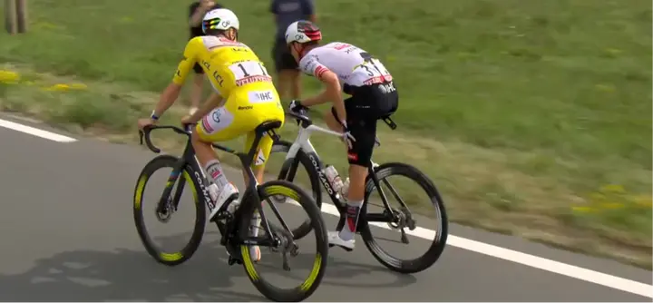 Tadej Pogacar speaks with Isaac Del Toro after the crash around 20 kilometres from the finish. The Mexican rider was visibly in pain.