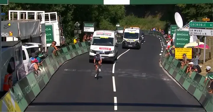 Brandon McNulty crossing the intermediate sprint by himself, before withdrawing from the Tour de France