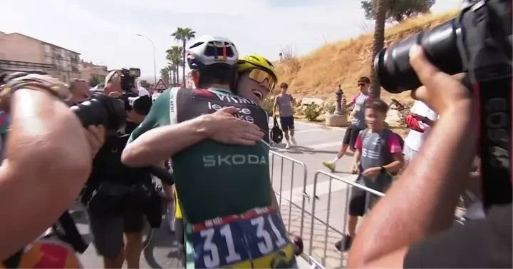 Wout Van Aert and Matthew Brennan celebrate stage 13 victory