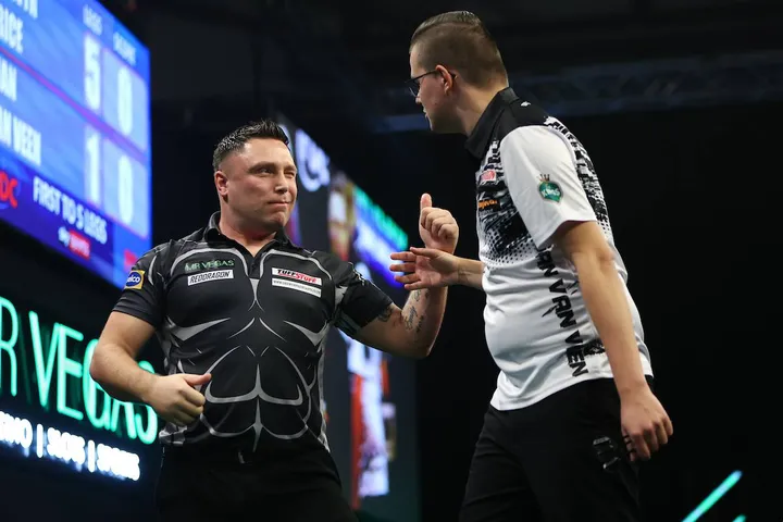 Gerwyn Price and Gian van Veen greet each other on stage