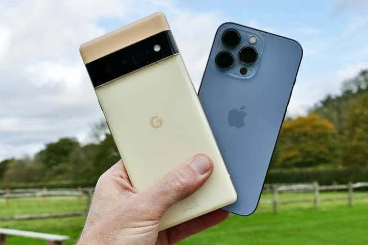pixel 6 pro and iphone 13 pro in hand back edit