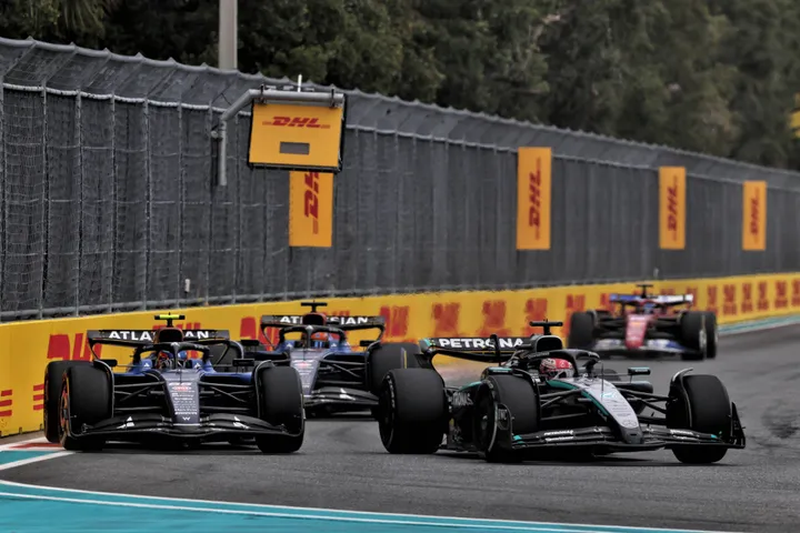 Carlos Sainz (ESP) Atlassian Williams Racing FW46 and George Russell (GBR) Mercedes AMG F1 W16 battle for position.