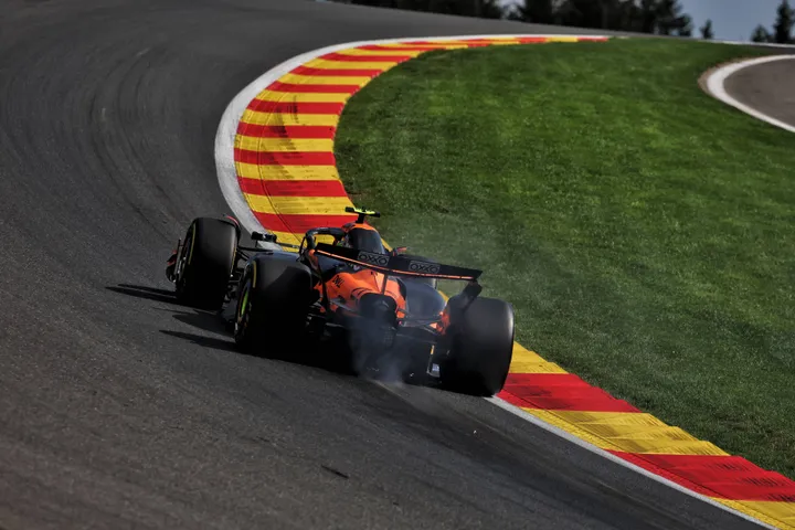 Lando Norris' smokey McLaren climbing up Eau Rouge