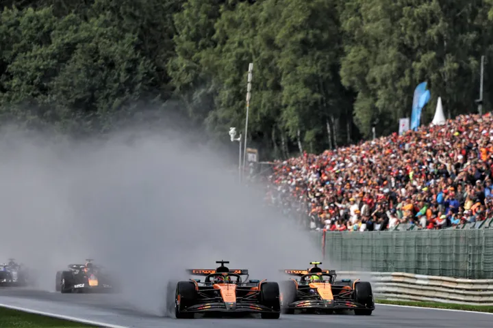 Oscar Piastri overtakes Lando Norris for the win at Belgium