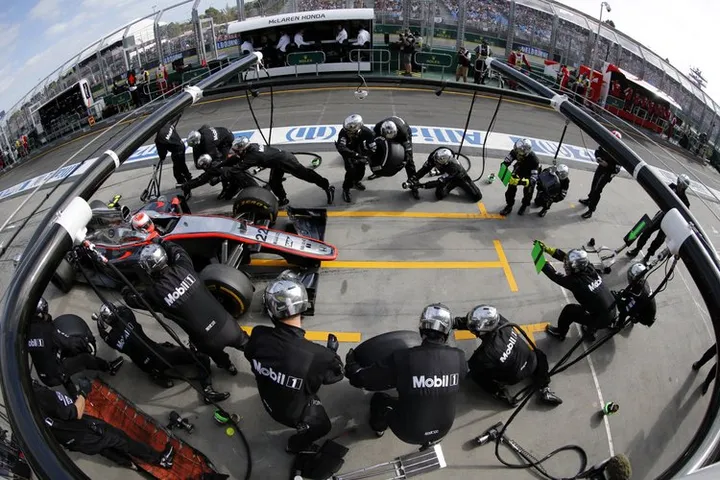 Jenson Button makes a pit stop.