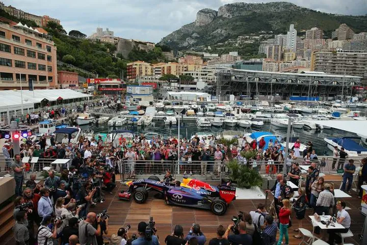 MONTE-CARLO, MONACO - MAY 22:  Sebastian Vettel of Germany and Infiniti Red Bull Racing shows French rally driver Sebastien Ogier around the Red Bull Energy Station and showcar during previews to the Monaco Formula One Grand Prix at the Circuit de Monaco on May 22, 2013 in Monte-Carlo, Monaco.  (Photo by Bryn Lennon/Getty Images) *** Local Caption *** Sebastian Vettel; Sebastien Ogier