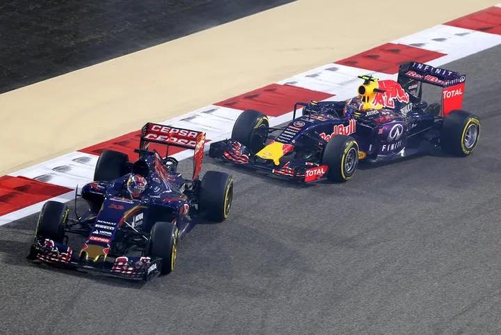 Max Verstappen of Netherlands and Scuderia Toro Rosso is followed by Daniil Kvyat of Russia and Infiniti Red Bull Racing during the Bahrain Formula One Grand Prix at Bahrain International Circuit on April 19, 2015 in Bahrain, Bahrain.